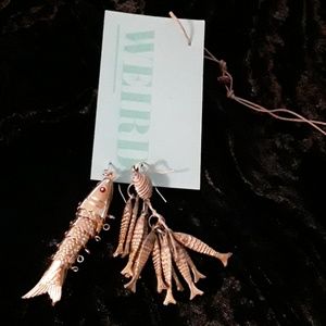 Earrings, dangly, asymmetrical.